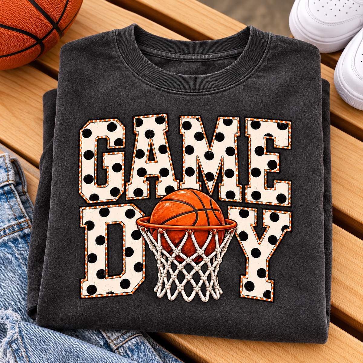 Cream polka-dot GAME DAY lettering with an orange basketball and white net replacing the A in DAY. Shown on a charcoal crewneck sweatshirt.