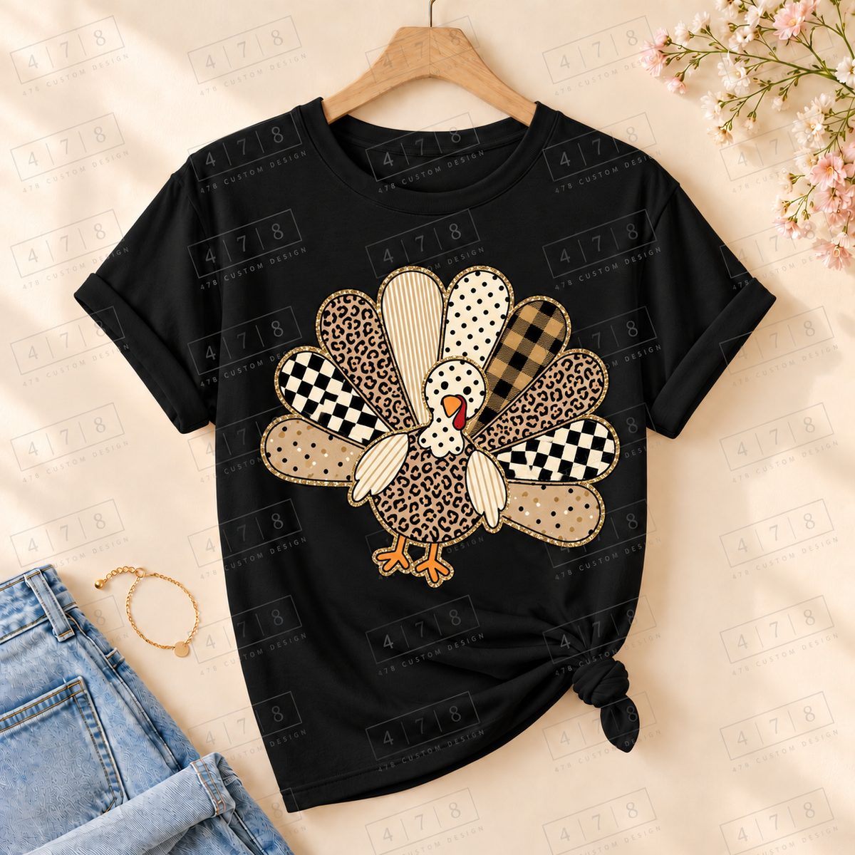 Neutral patchwork turkey on a black knotted T-shirt