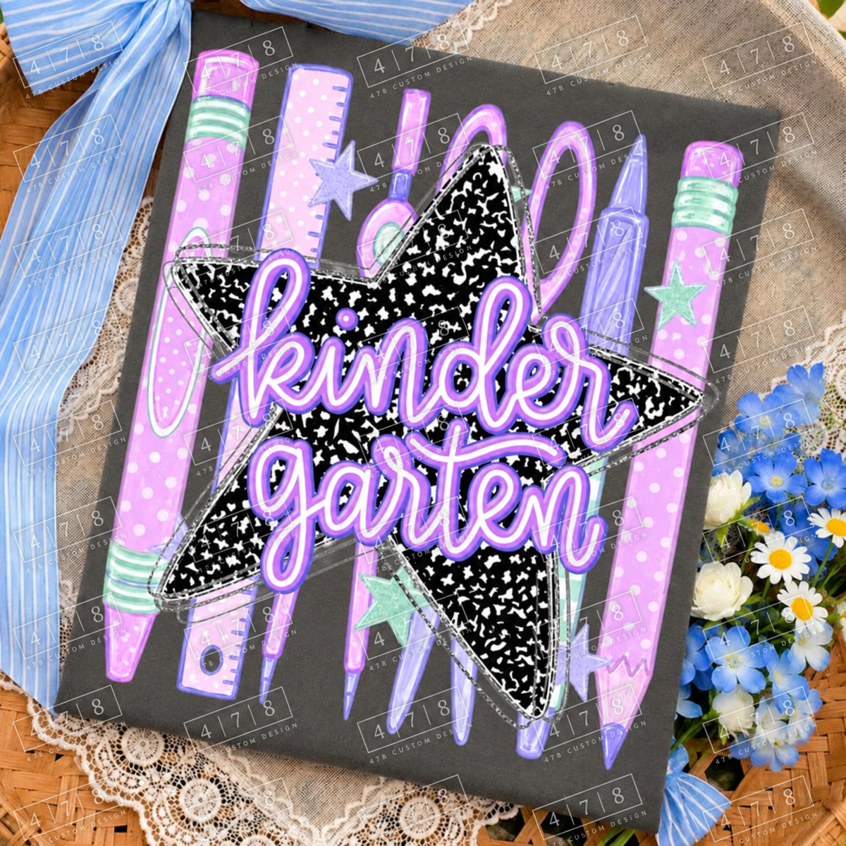 Kindergarten pastel school supplies notebook star design — charcoal folded shirt