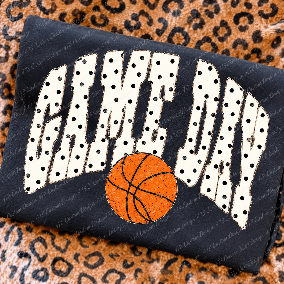 Polka Dot Game Day Basketball design on a folded charcoal shirt
