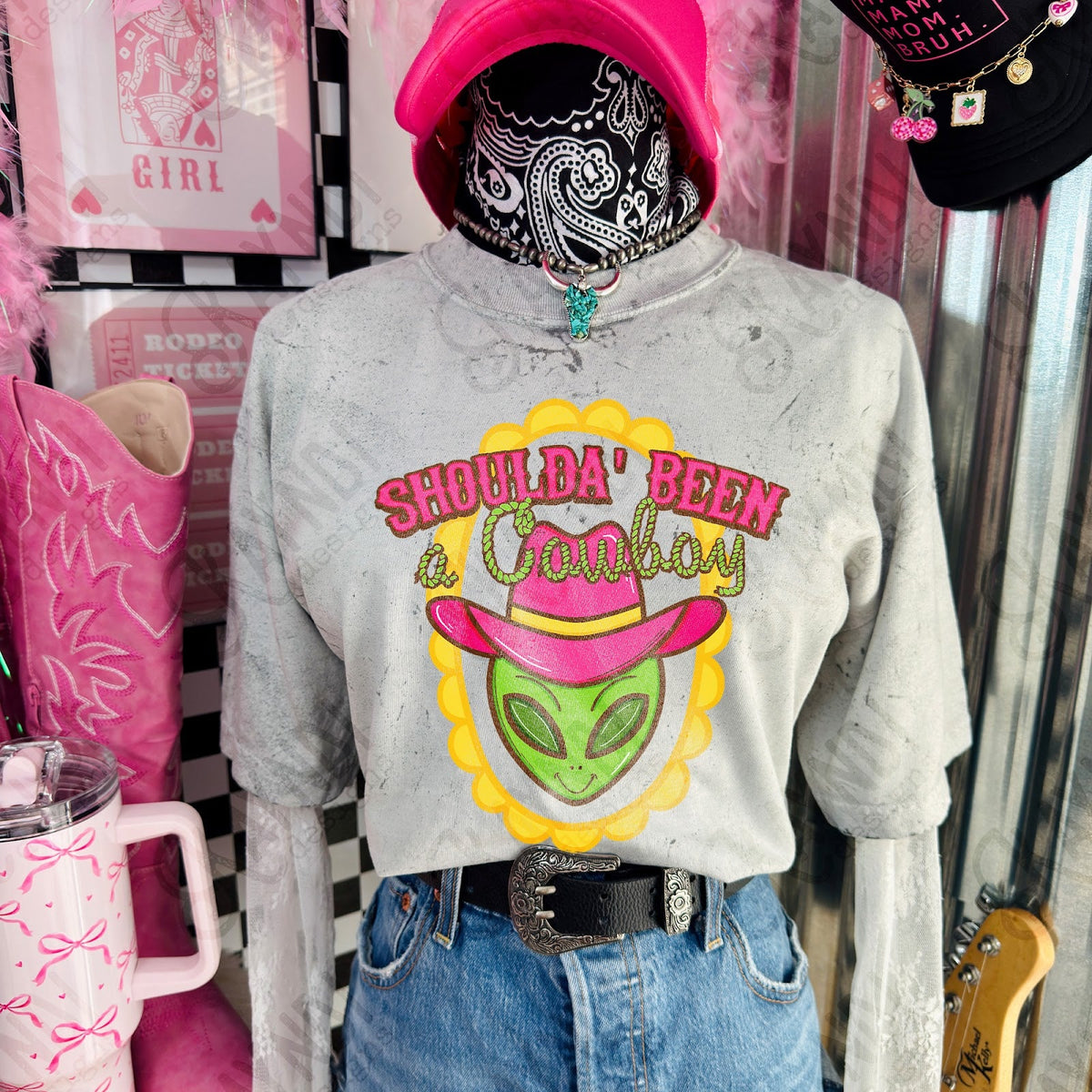 Shoulda Been a Cowboy alien design shown on a gray shirt