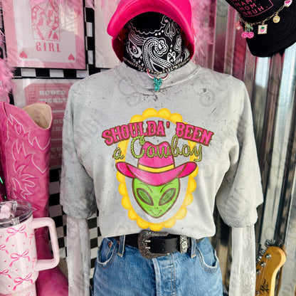 Shoulda Been a Cowboy alien design shown on a gray shirt