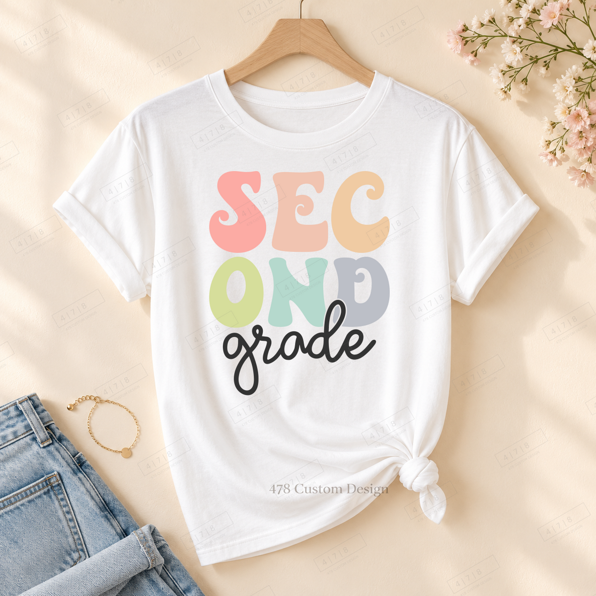 Second Grade cutout design on rolled-sleeve tied white tee with 478 watermark