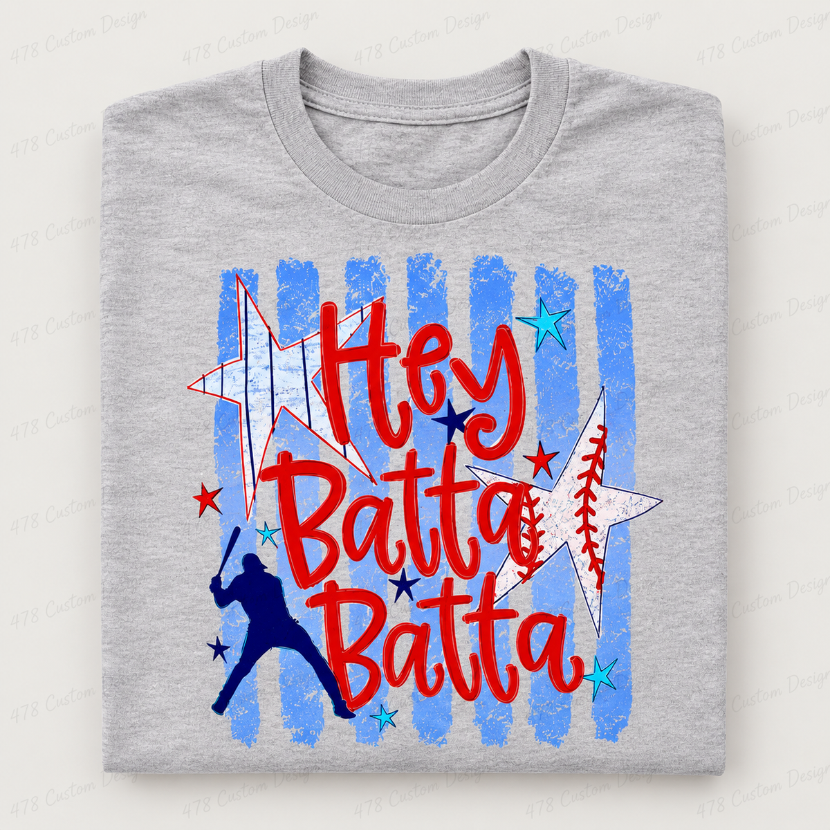 Hey Batta Batta baseball design on a gray folded shirt