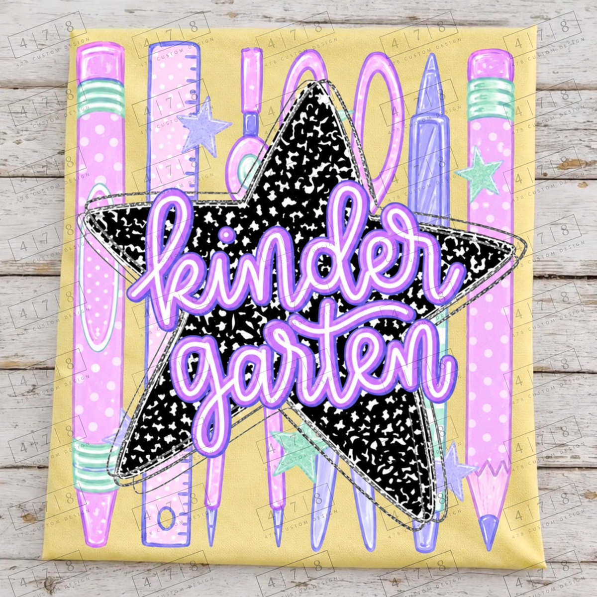 Kindergarten pastel school supplies notebook star design — yellow folded shirt