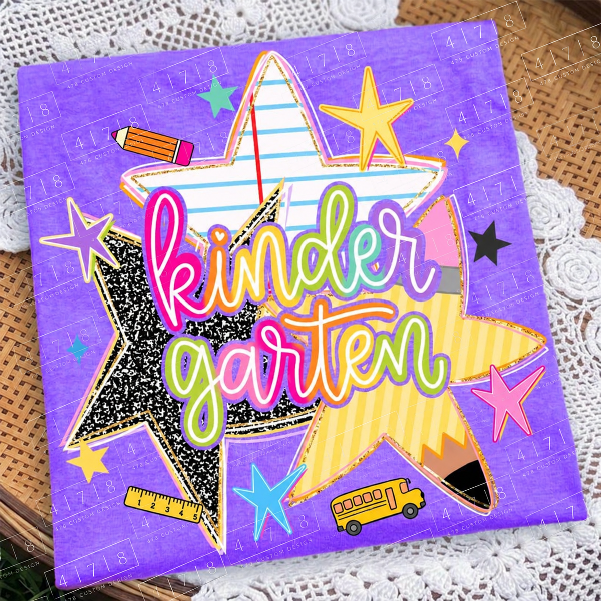 Kindergarten rainbow school stars design on a purple folded shirt