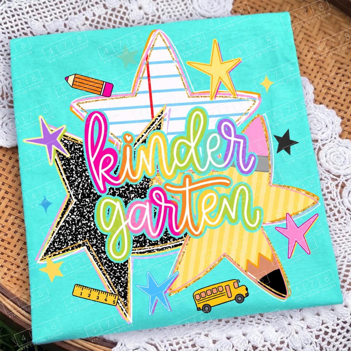 Kindergarten rainbow school stars design on an aqua folded shirt