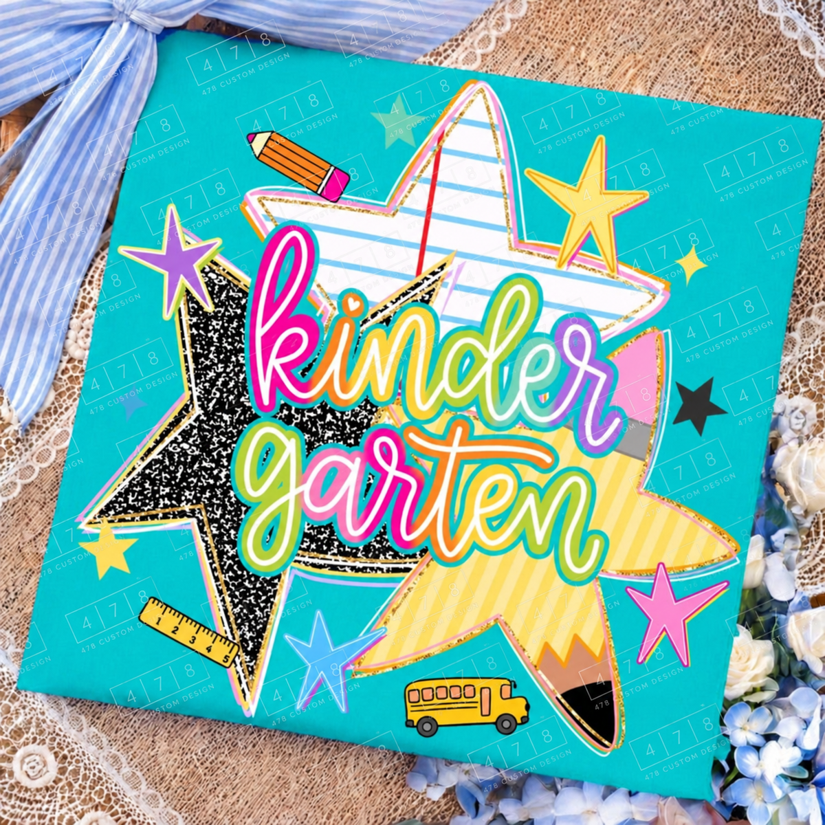 Kindergarten rainbow school stars design on a teal folded shirt