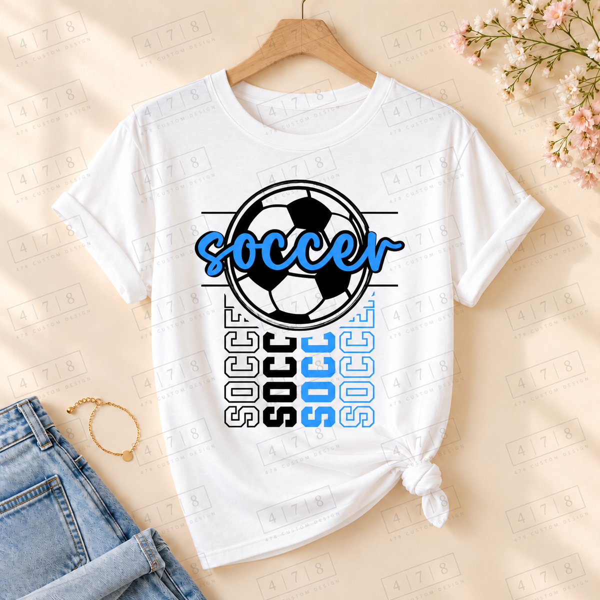 Blue Script Soccer Ball Top on a white T-shirt