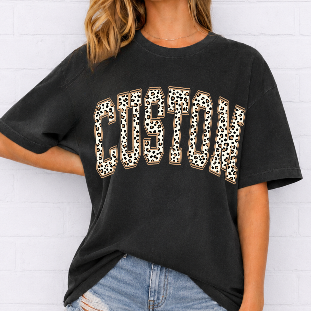 Custom brown leopard print varsity arch lettering on a black tee
