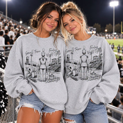 Custom band Friday Night Lights design shown on two girls in gray crewneck sweatshirts