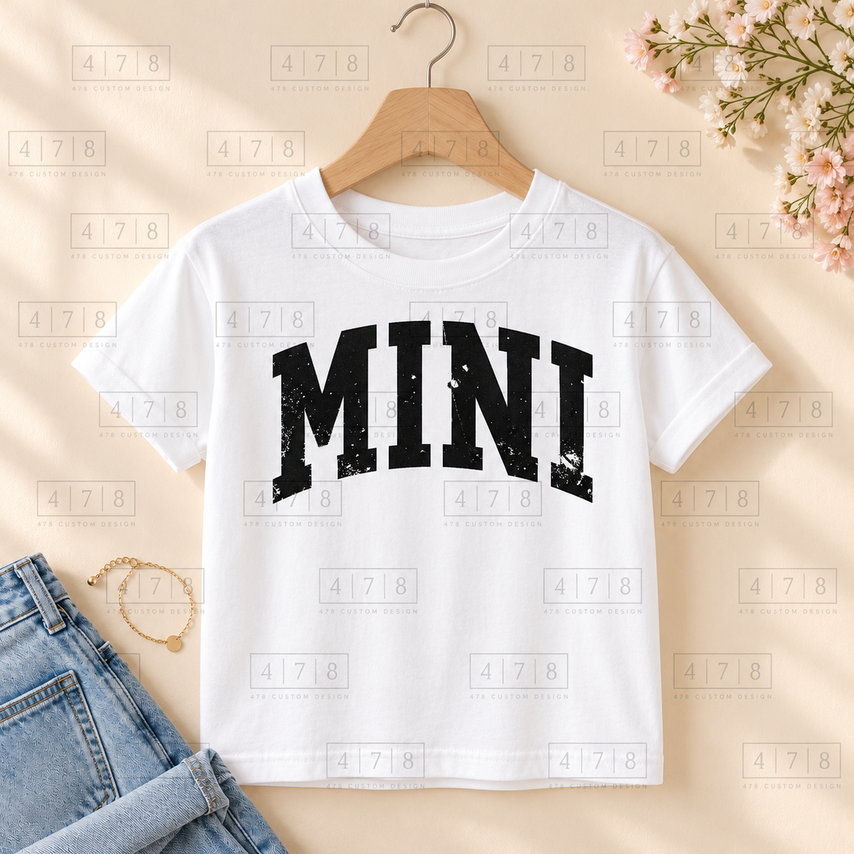 002 Mini DISTRESSED blk on a white shirt