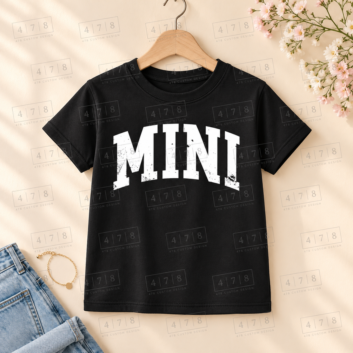 002 Mini DISTRESSED wht on a black shirt