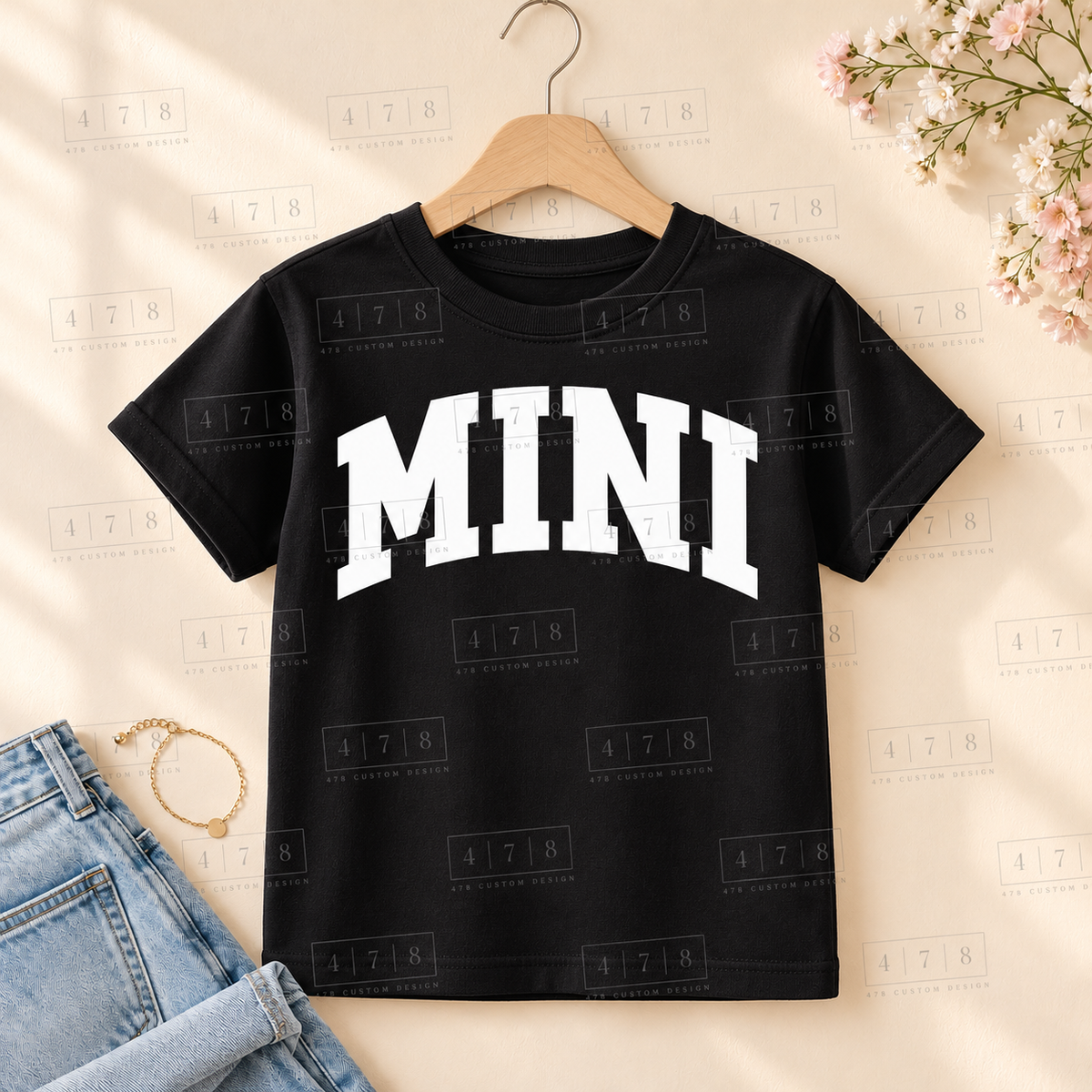 002 Mini SMOOTH wht on a black shirt