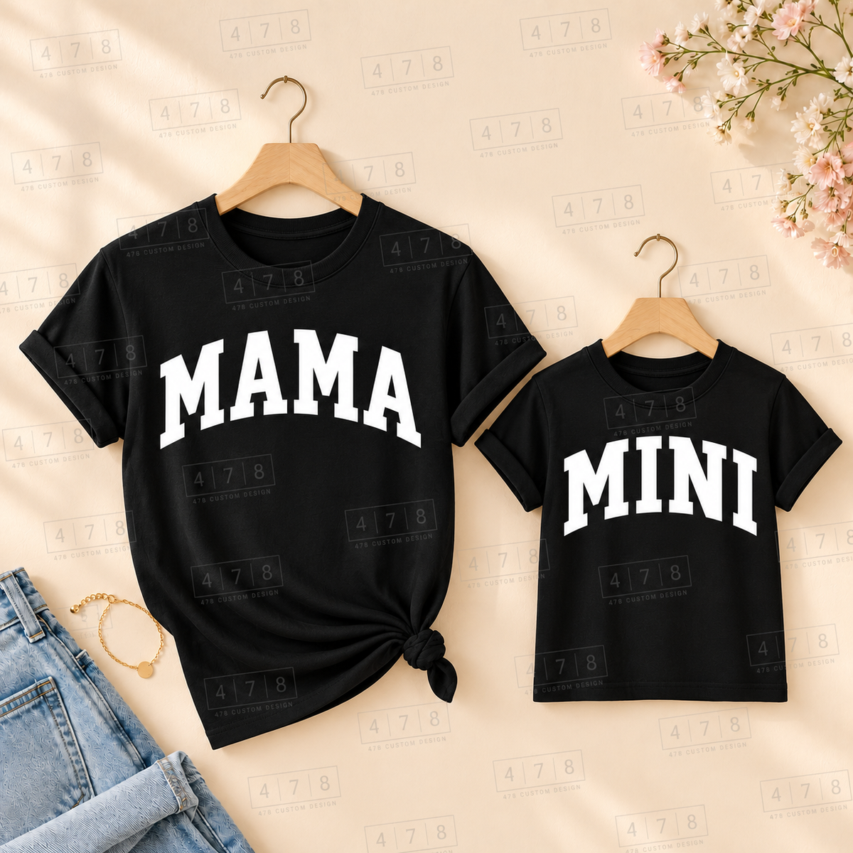 Matching Mama and Mini smooth designs in white ink on black shirts; each shirt sold separately