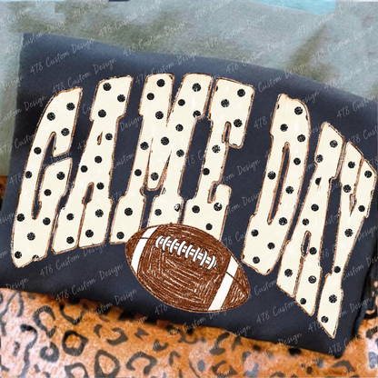 Polka dot Game Day football design on a slate garment
