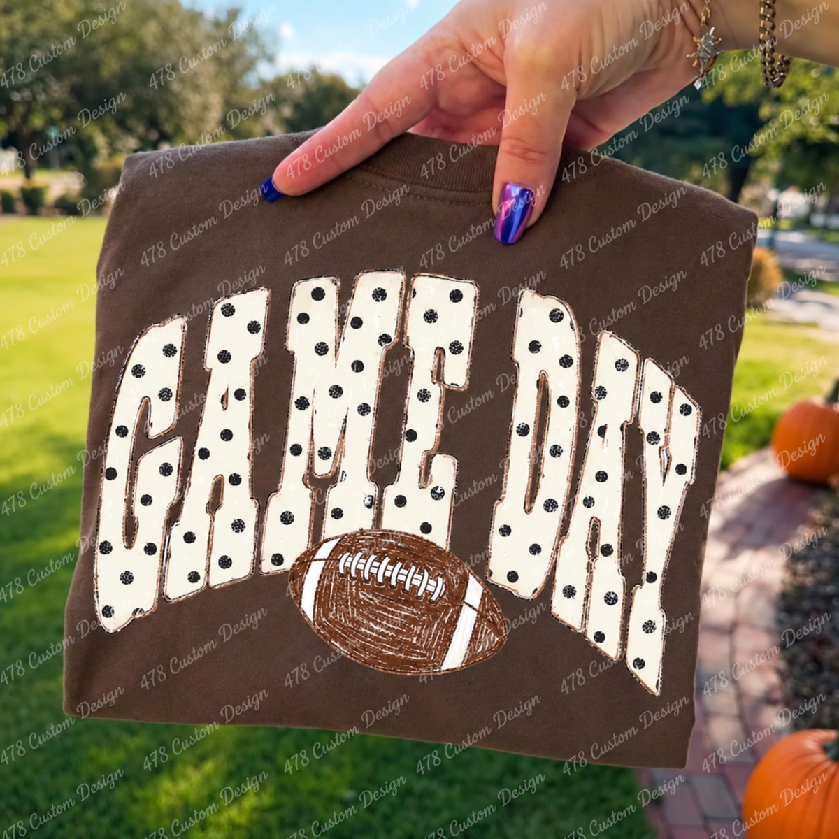 Polka dot Game Day football design on a brown garment