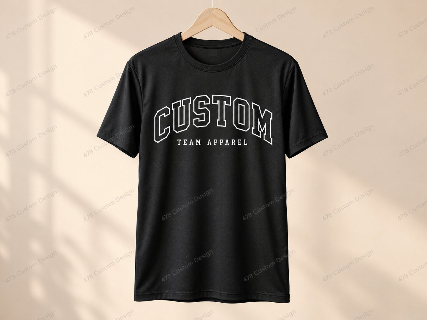 CUSTOM team apparel on a black athletic shirt